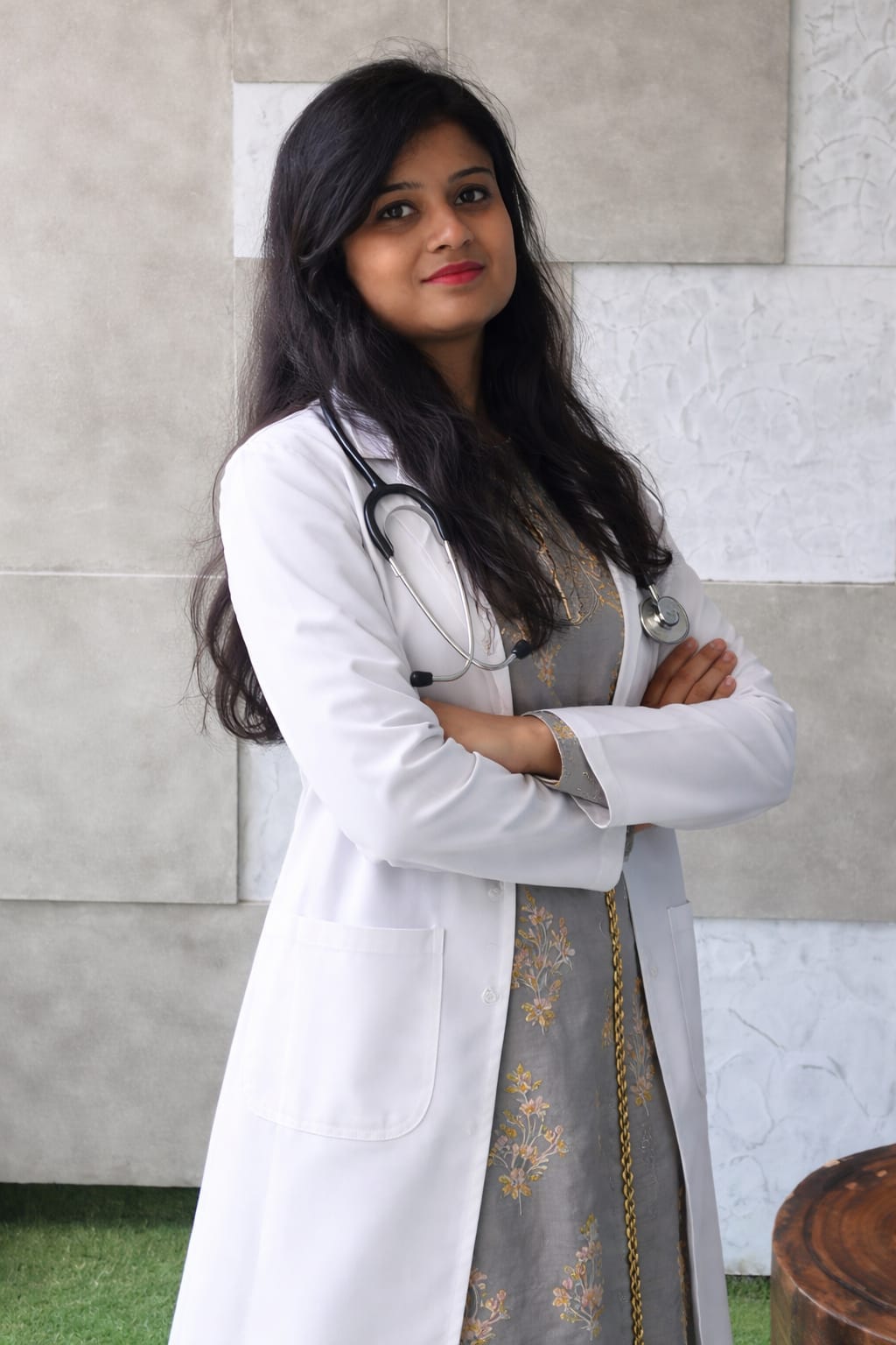 Dr. SUMAN B